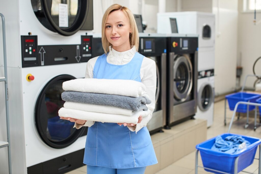 portrait laundry worker background clothes hangers dry cleaning 154092 5784 portrait laundry worker background clothes hangers dry cleaning 154092 5784