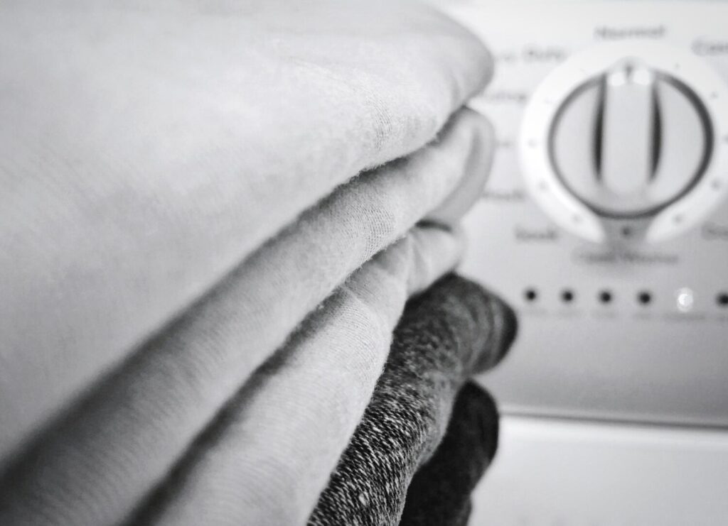 close up clothes stacked indoors 1048944 5100041 close up clothes stacked indoors 1048944 5100041
